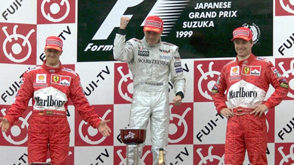 Michael Schumacher, Mikä Häkkinen ja Eddie Irvine Japanin GP:n palkintopallilla 1999.