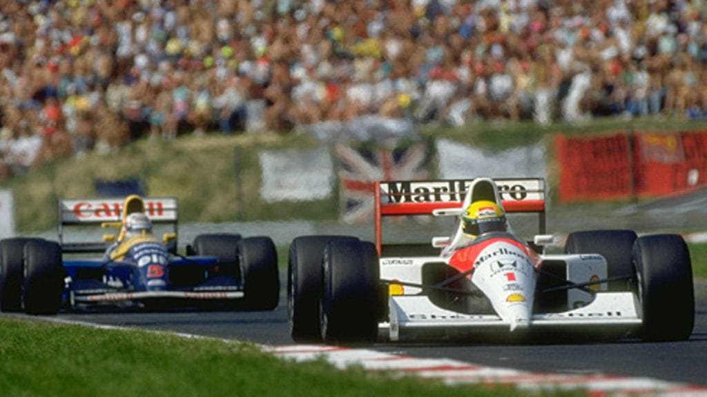 McLaren-kuljettaja Ayrton Senna ja Williams-kuljettaja Nigel Mansell Unkarin GP:ssä 1991 (Photo: Pascal Rondeau / Allsport)