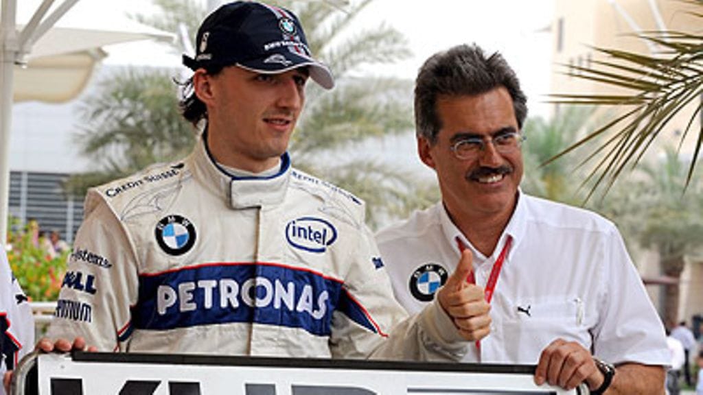 Robert Kubica ja Mario Theissen (Kuva: EPA/MAZEN MAHDI)