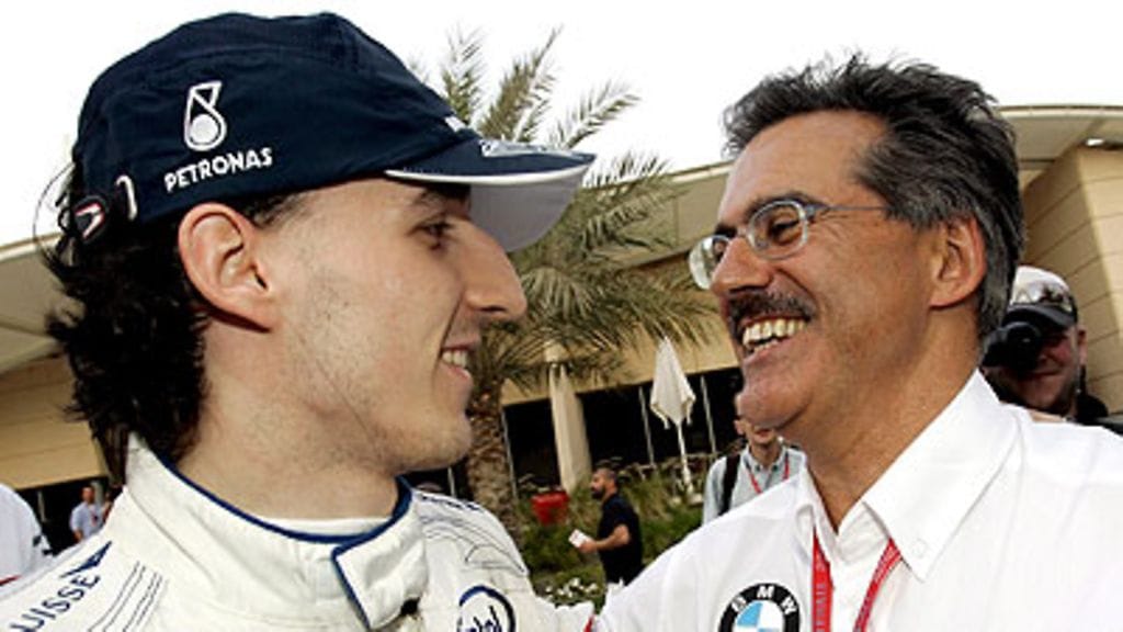 Robert Kubica ja Mario Theissen, kuva: EPA/FELIX HEYDER