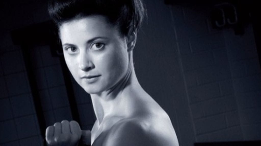 JYP Naisten -kalenterin kansikuvassa poseerasi Vancouverista olympiapronssia pokannut puolustaja Jenni Hiirikoski, 2010.