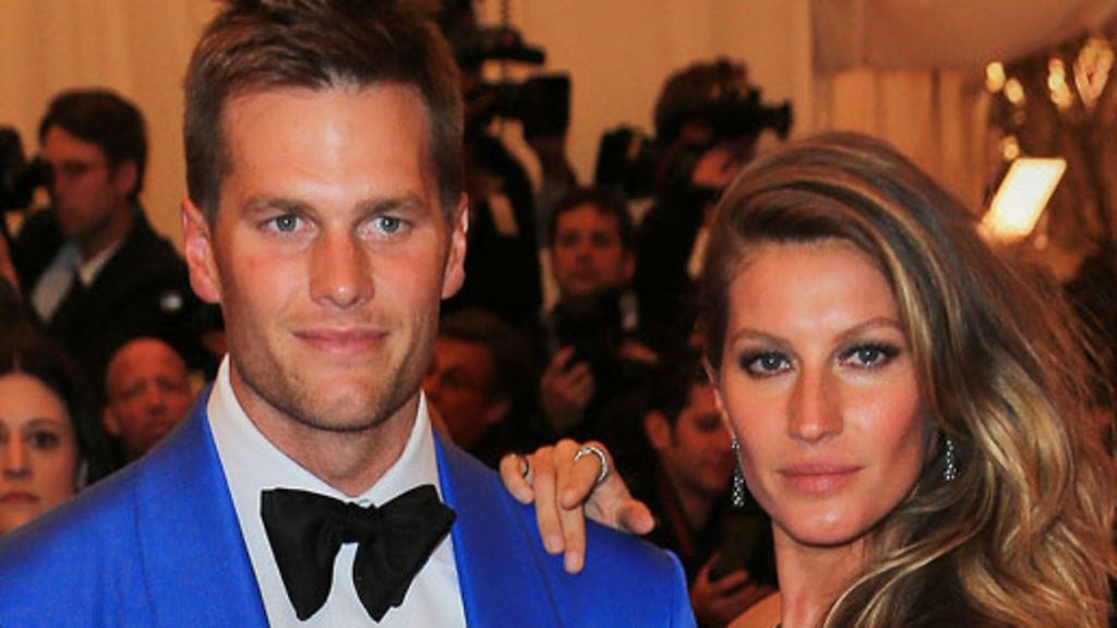 Gisele puolisonsa Tom Bradyn kanssa.