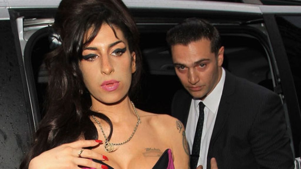 Amy Winehouse ja Reg Traviss (Wireimage)
