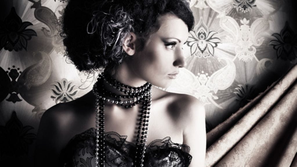 Camille Clifford oli aikansa naisikoni ihanteellisena pidettyjen, s-korsetilla muovatun vartalonsa vuoksi.. Kuva: Shutterstock