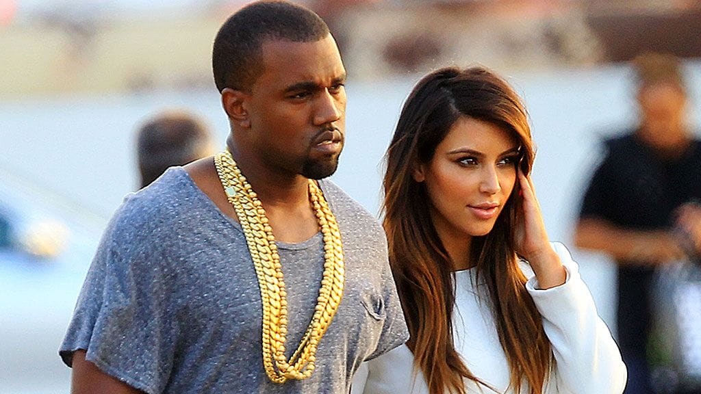 Kanye West ja puoliso Kim Kardashian.