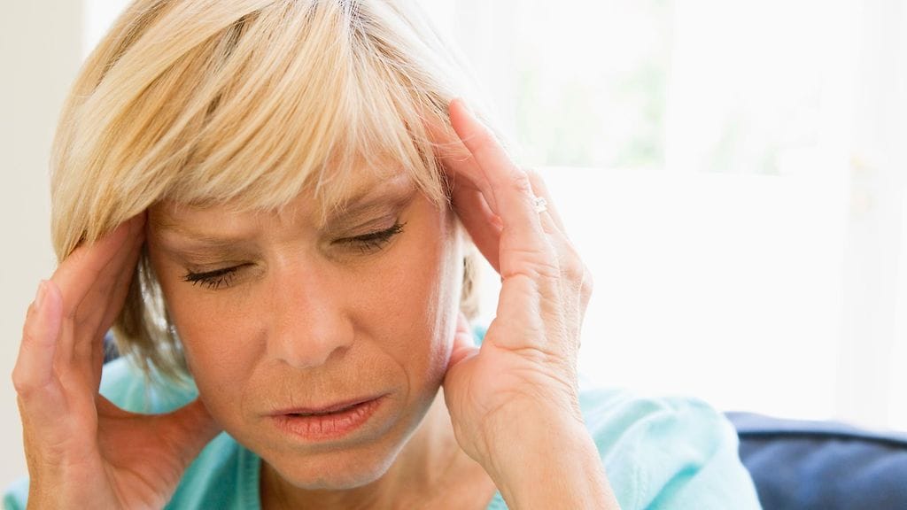 Krooninen päänsärky voi haitata elämää. Kuvituskuva.