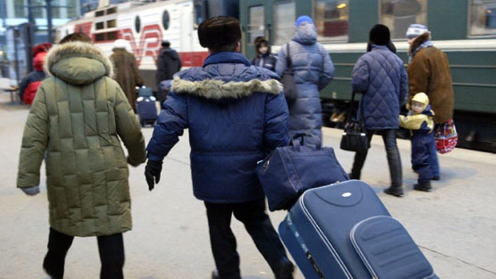 Venäläisiä turisteja Helsingin rautatieasemalla..