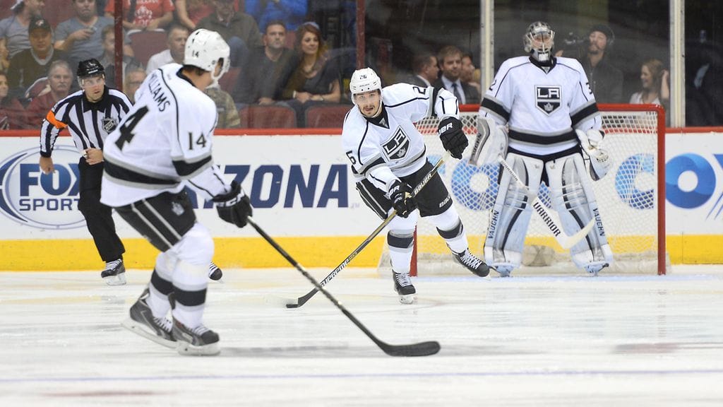 Slava Voinov (kesk.) teki Kingsissä pelaamillaan neljällä kaudella 190 ottelussa tehot 18+81.