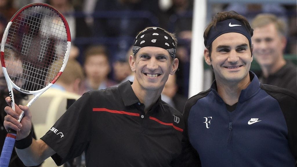 Jarkko Nieminen (vas.) ja Roger Federer.