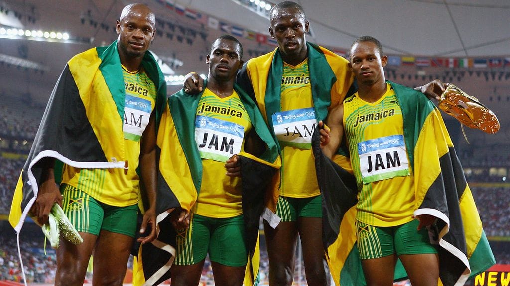 Asafa Powell (vas.), Nesta Carter, Usain Bolt ja Michael Frater juoksivat Jamaikalle kultaa kahdeksan vuotta sitten Pekingissä.