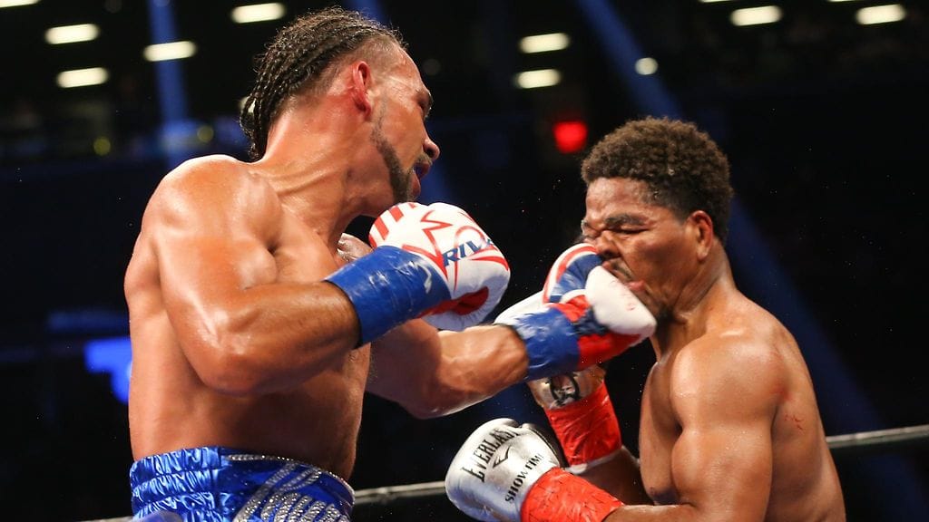 Shawn Porter vastaanottaa Keith Thurmanin iskun.