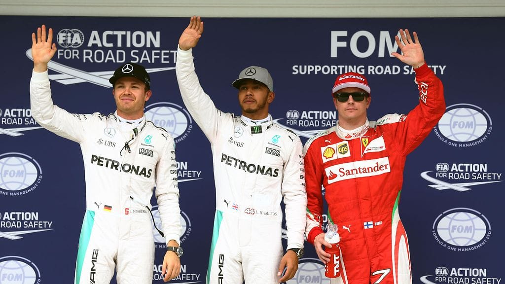 Kimi Räikkönen juhli kolmossijaa Nico Rosbergin ja Lewis Hamiltonin rinnalla.