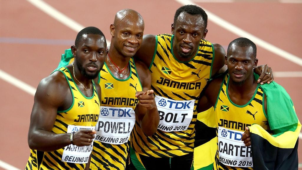Nesta Carter (oik.) juhli MM-viestikultaa Nickel Ashmeaden, Asafa Powellin ja Usain Boltin kanssa Pekingissä 2015.