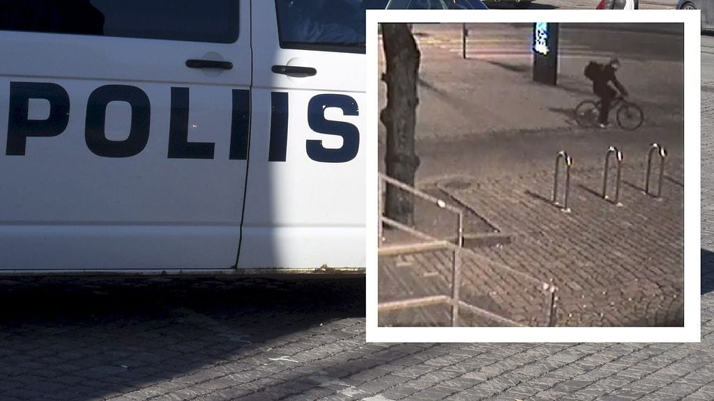 Poliisin julkaisemassa valvontakamerakuvassa näkyy tummiin pukeutunut pyöräilijä täysi reppu selässään.