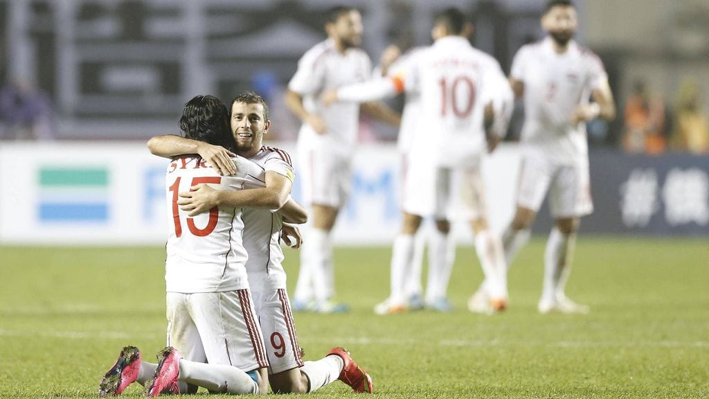 Syyrian pelaajat juhlivat viime vuonna ottelun ainoaksi jäänyttä maalia Kiinaa vastaan jalkapallon MM-karsinnoissa.