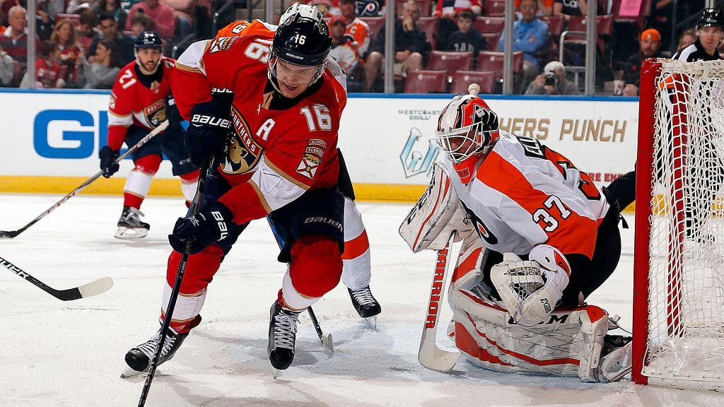 Aleksander Barkov Brian Elliottin vartioimalla maalilla.