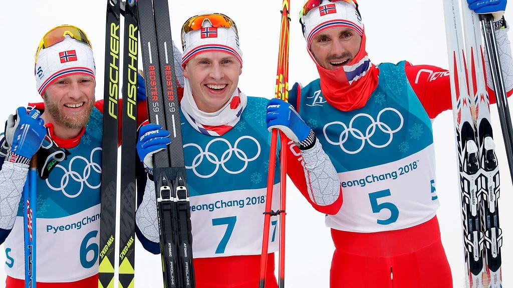 Martin Johnsrud Sundby, Simen Hegsted Krüger ja Hans Christer Holund juhlimassa.