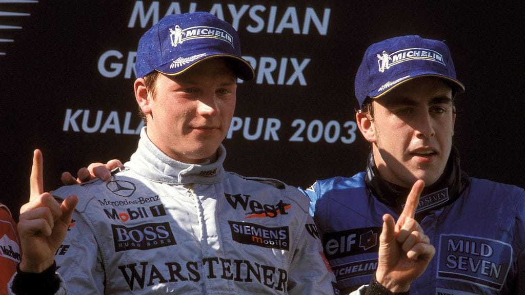 Kimi Räikkönen ja Fernando Alonso suomalaisen ensimmäisessä kisavoitossa Malesiassa 2003.