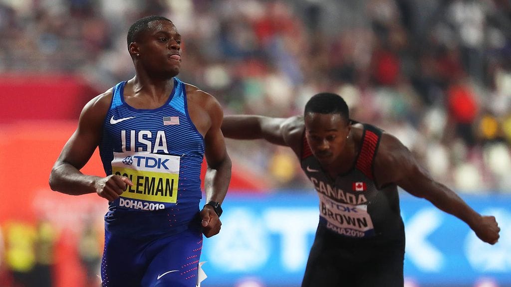 Christian Coleman (vas.) vakuutti MM-välierässä Dohassa.