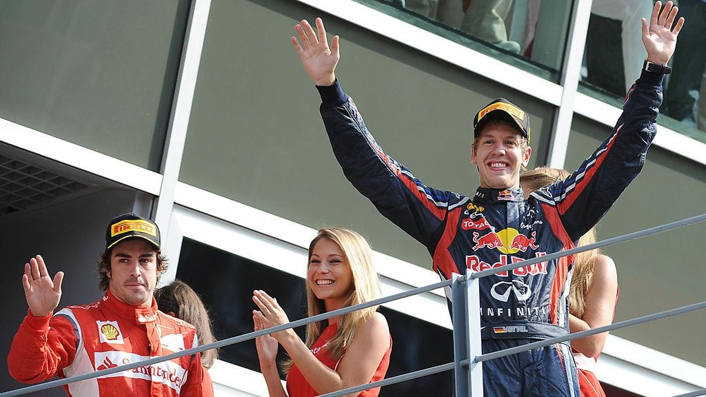 Fernando Alonso ja Sebastian Vettel Monzan palkintopallilla