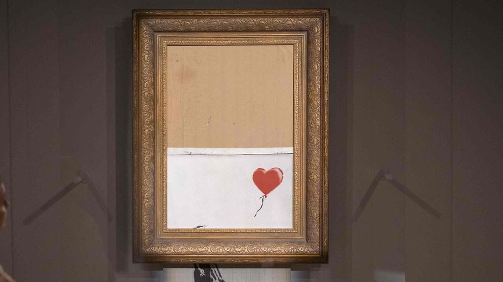 Katutaitelija Banksyn osittain silputtu teos Love is in the Bin (Rakkaus on roskiksessa) myytiin torstaina huutokaupassa Lontoossa.