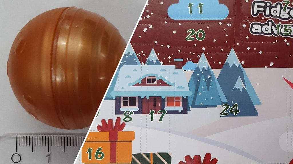 Kalenterin luukussa 16 on tukehtumisvaaran aiheuttava kapselipallo.