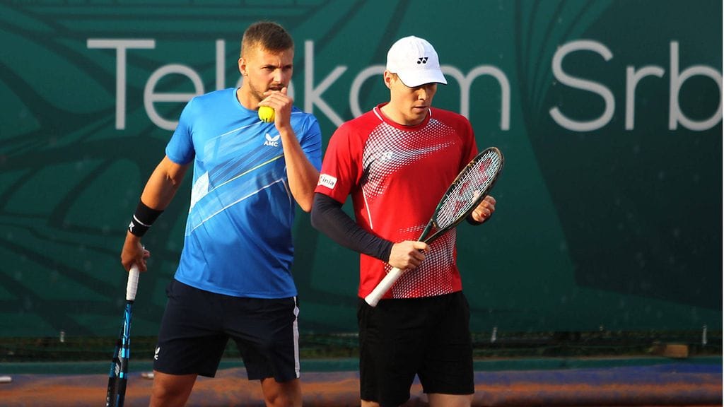 Harri Heliövaara (oik.) eteni parinsa Lloyd Glasspoolin kanssa Münchenin turnauksen välieriin.