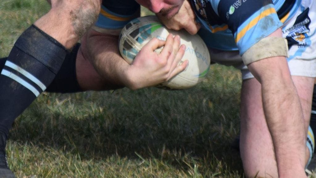 20-vuotias urheilija pelasi australialaista jalkapalloa. Kuvituskuva.