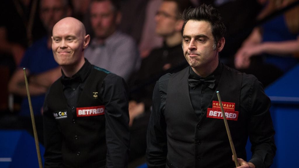 Ronnie O'Sullivan (oik.) ja Gary Wilson ovat kohdanneet muun muassa MM-kisoissa huhtikuussa 2017. Wilson hävisi tuolloin MM-debyyttinsä erin 7–10.