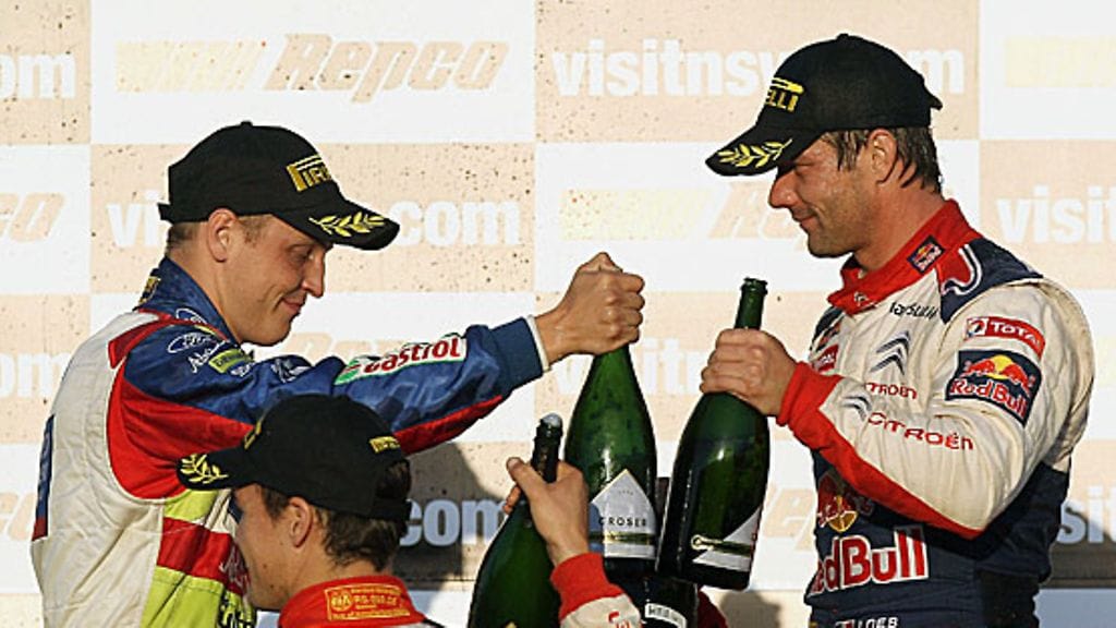 Mikko Hirvonen ja Sébastien Loeb skoolaavat Katalonian rallin päätteeksi. Kuva: Quinn Rooney/GETTY.