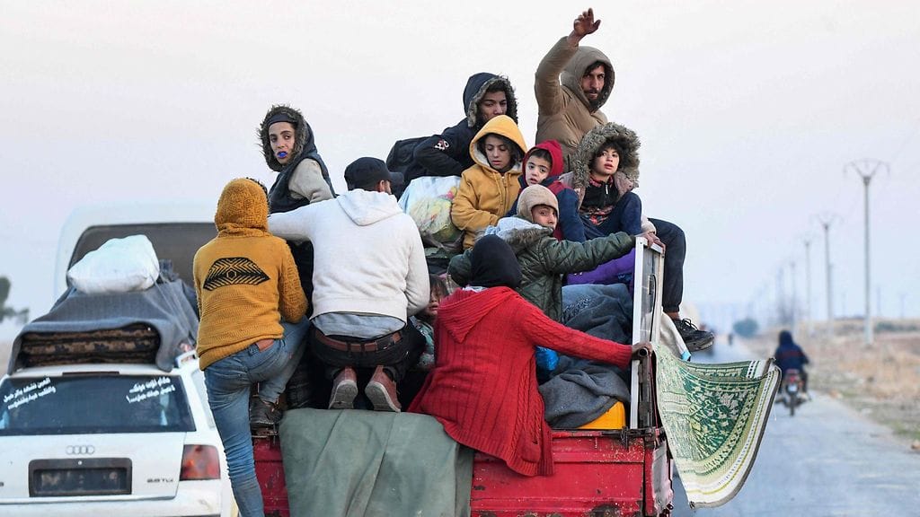 Kodeistaan paenneita Syyriassa 2. joulukuuta.