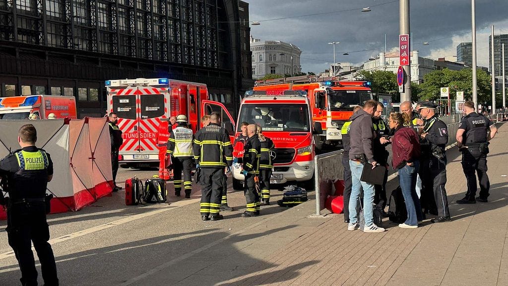 Members of the emergency services work at the scene at Hamburg's main train station where several people have been stabbed on May 23, 2025
