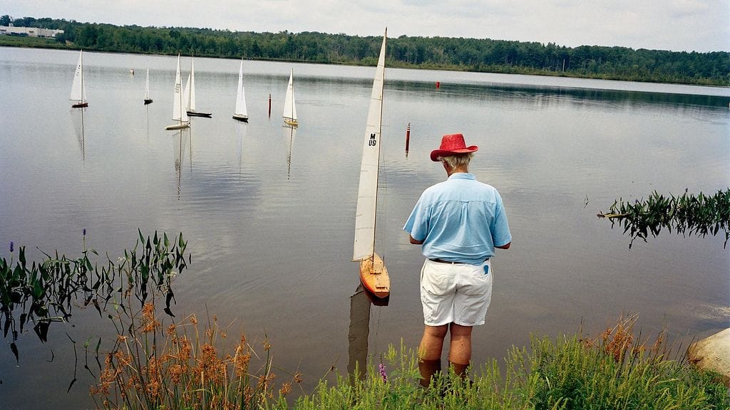 Perfectible Worlds, Man at radio-controlled sailboat regatta, Gilford, NH, 2003 © Sage Sohier
