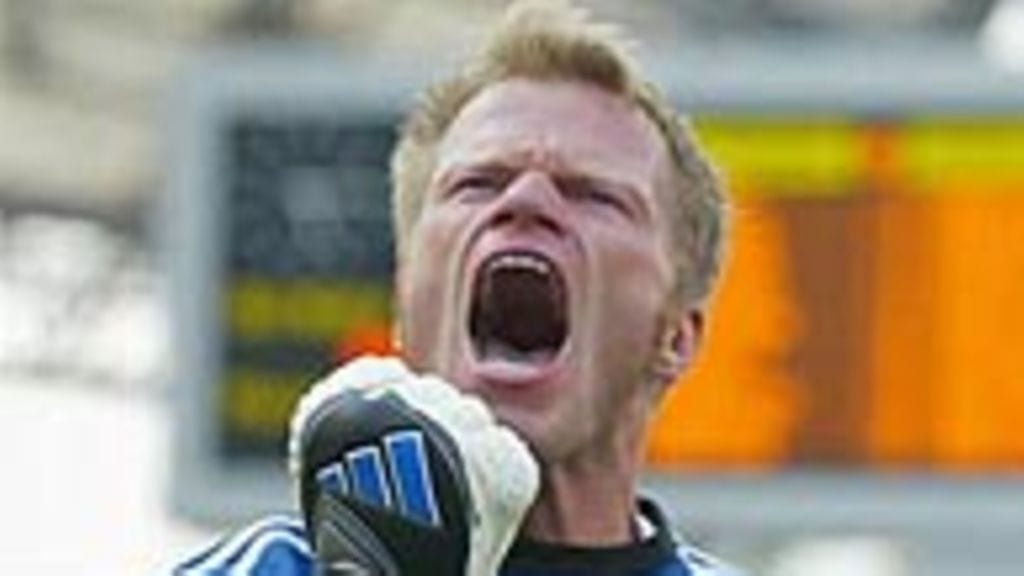 Kahn riemuitsee, Photo: Ben Radford / Allsport